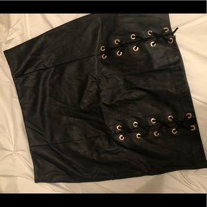 Black faux leather detailed skirt.